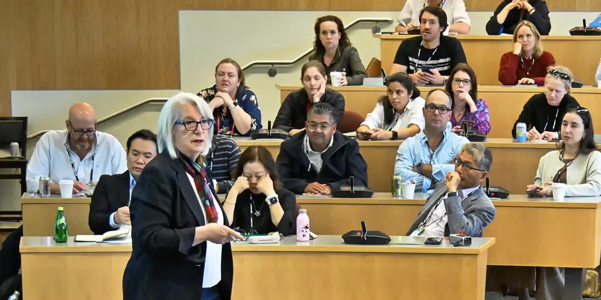 Woman speaks to classroom