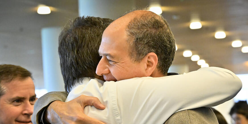 Two men embrace