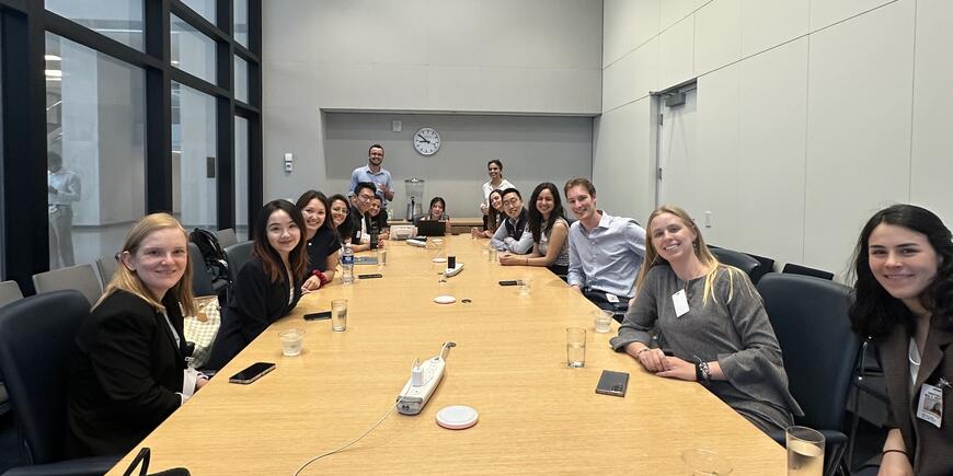Students sitting around a conference table at IMF