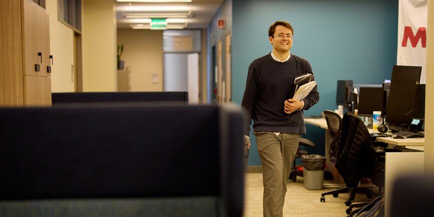 PhD student Alex Busch leaves his office for the day