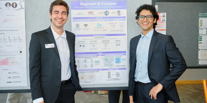 Students in front of poster