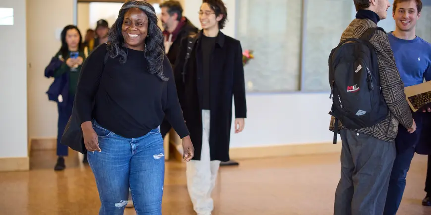 Alecia Asiamigbe walks through the halls of MIT Sloan