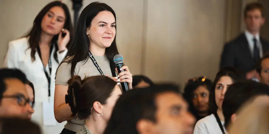 student with microphone 
