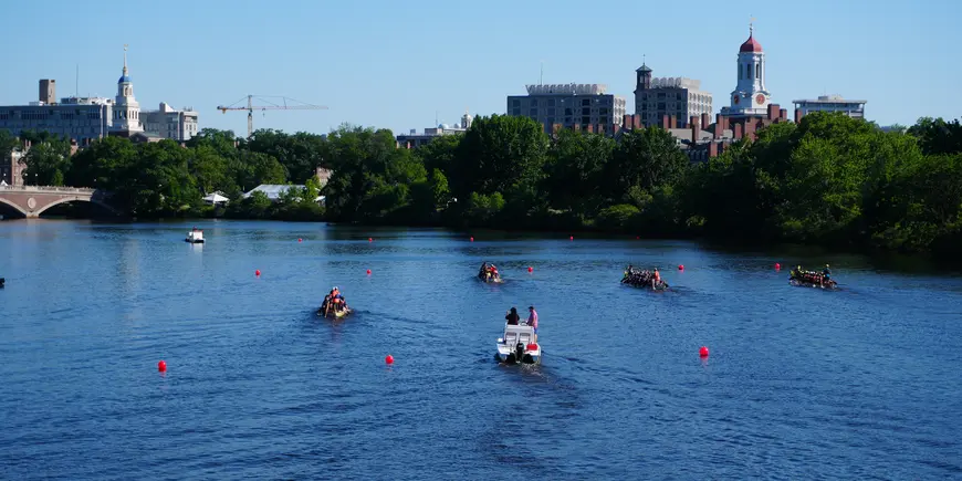 Racer and pacer boats complete a race on the Charles River