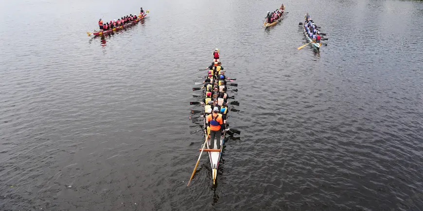 Several racing boats pause after a race
