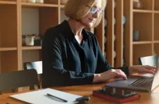 How Does Credit Supply Expansion Affect the Real Economy? The Productive Capacity and Household Demand Channels