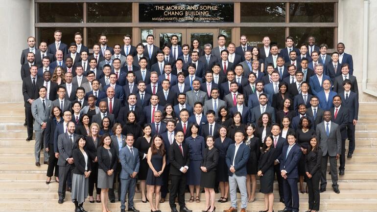 The SFMBA class of 2022 standing on the front steps leading into the Morris and Sophie Chang Building