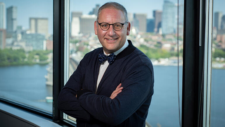 Photo of Steven Spear with Boston skyline in the background