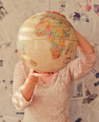 Woman holding globe