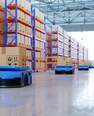 image of robots on a factory floor as part of an automated supply chain