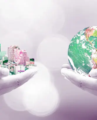 One hand holds a city and the other hand holds a globe