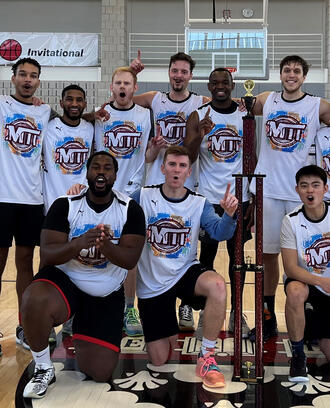 The MIT Sloan Basketball Club team poses for a group photo