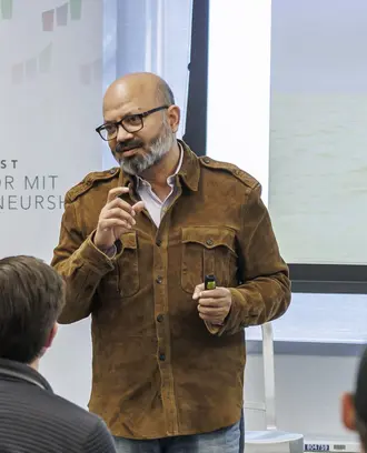 Kamal Quadir talks to students, faculty, and staff at the Trust Center