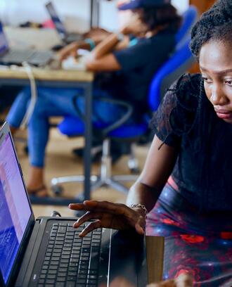 Two people looking at computer screens