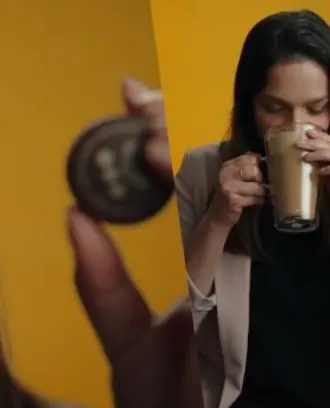 A split photo of Neha in front of a yellow background drinking from a cup of coffee beside a close up of her looking at a Keruig K Cup