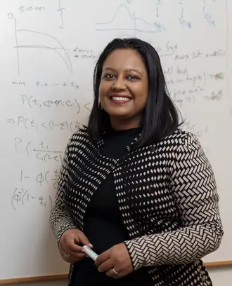 Professor Swati Gupta at a whiteboard
