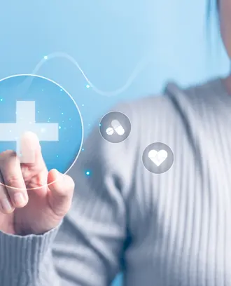 Graphic of woman's hand touching medical plus sign icon with light blue background