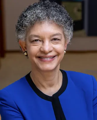 Susan Collins wearing a blue suit