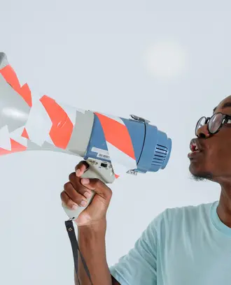Image of a young man with a megaphone
