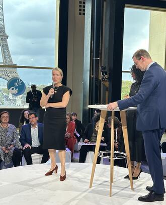 MIT Climate Policy Center Executive Director Bethany Patten Presents at the Paris Peace Forum. Eiffel Tower visible through window in background