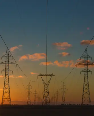 Power lines as the sun is getting ready to set