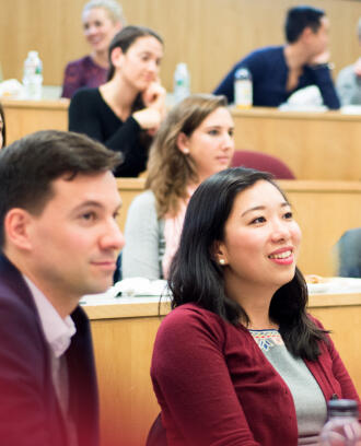Students in the MBA Early program listen in a lecture hall
