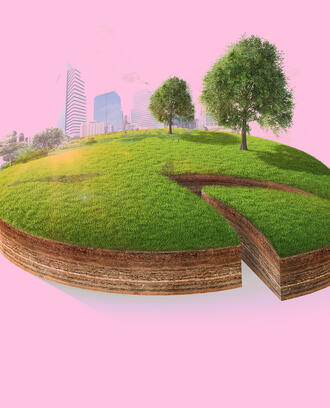 A pie chart resembling a piece of green land with a city skyline and trees 