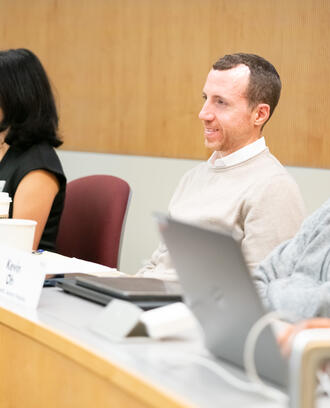 Students sitting in class smiling