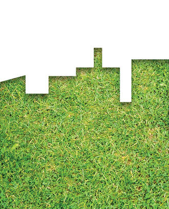 A city skyline silhouette made of grass