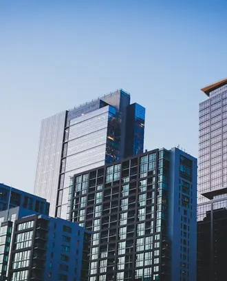 Photo of skycrapers against a clear blue sky