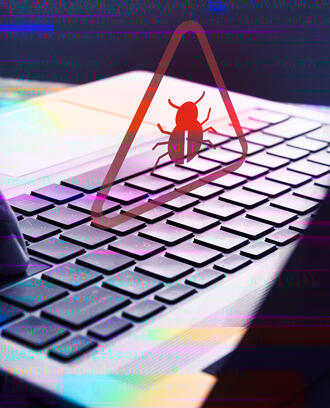 Malware attack virus alert shows up over laptop