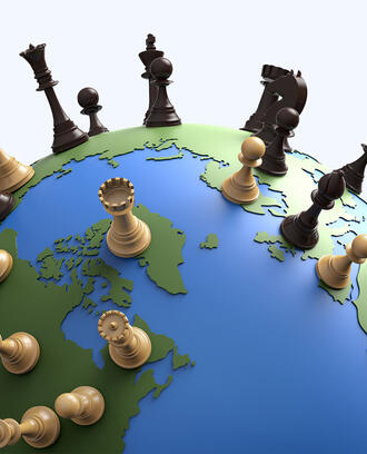 The world globe covered in chess pieces