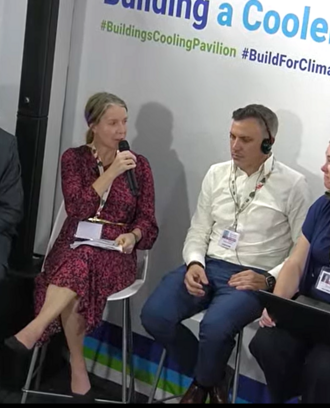 Event panelists speak with moderator