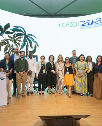 Large group of people pose for a photo at an event.