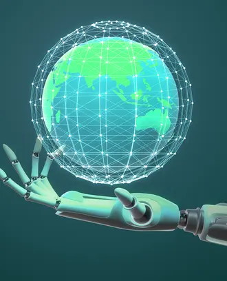 A robot hand holds a world globe