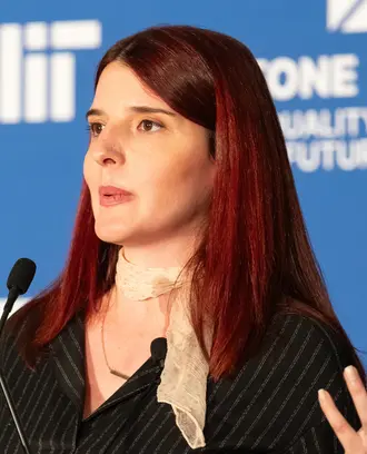 Scholar Zana Buçinca speaking at an MIT event
