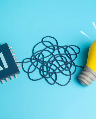 A long wire is between an AI chip and a lightbulb