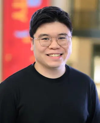 Headshot of a man in glasses