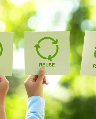People holding recycling signs