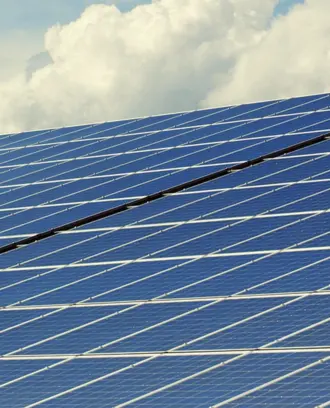 Image of Solar Panels with Clouds in the Background