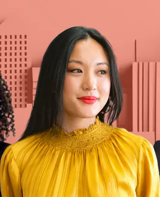 three women in front of city skyline