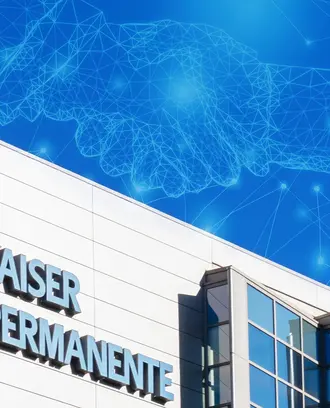 The Kaiser Permanente building with an abstract AI/digital image of a handshake in the sky