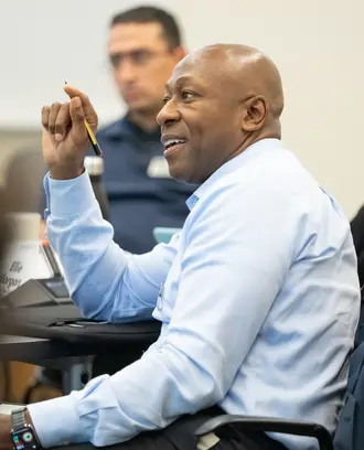 Patrick Parker, EMBA '24, in class answering a question
