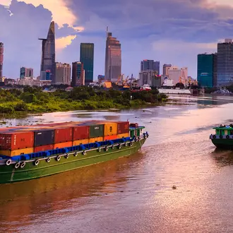 cargo boats and cityscape