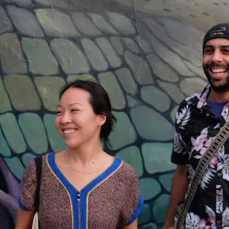 Linda Cheung in front of her mural. 