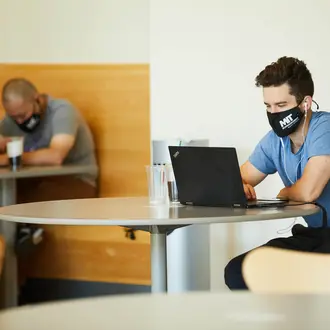 A photo of students working on campus