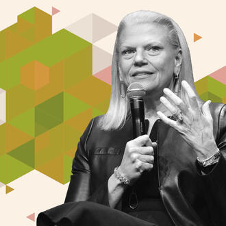 Former IBM CEO holds a microphone in her right hand, while she gestures with her left hand, her palm facing inward