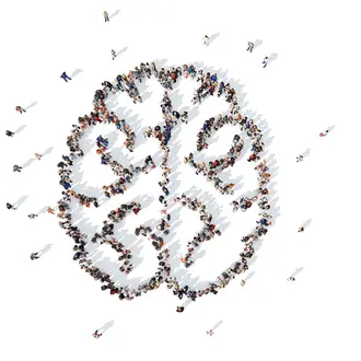 Image of a group of people arranged into the shape of a brain