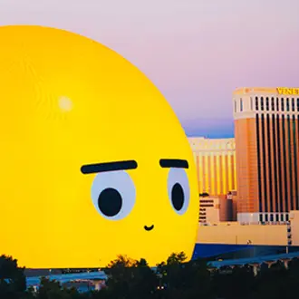Las Vegas skyline with Sphere depicting giant emoji in foreground