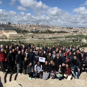 Large group of students posing for photo on Mount of Olives in Israel